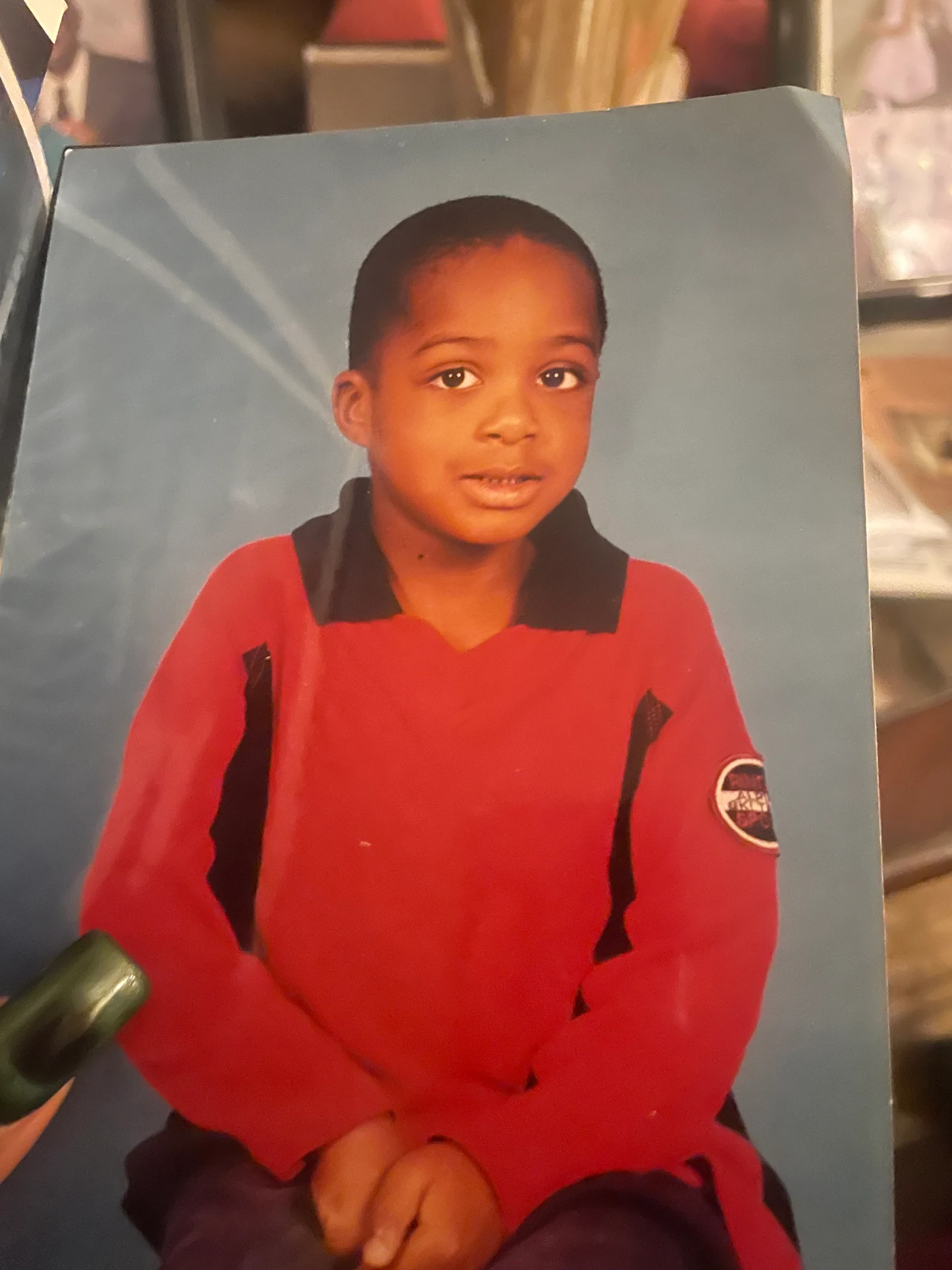 Child wearing a red polo, the starting photo for a precise GPT Image 2.5 edit